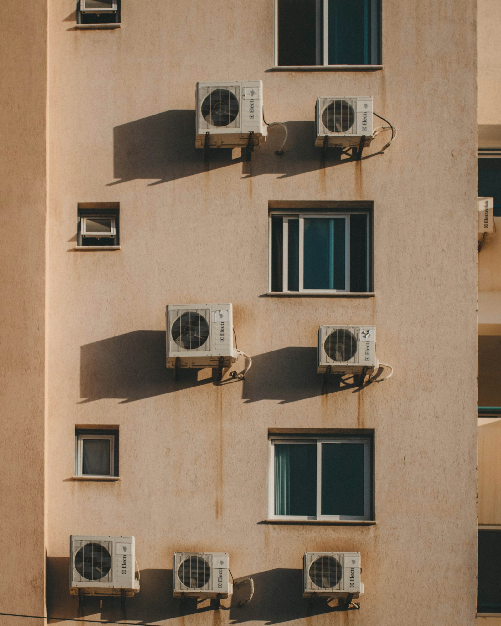 Multiple outdoor air conditioning units on a building exterior